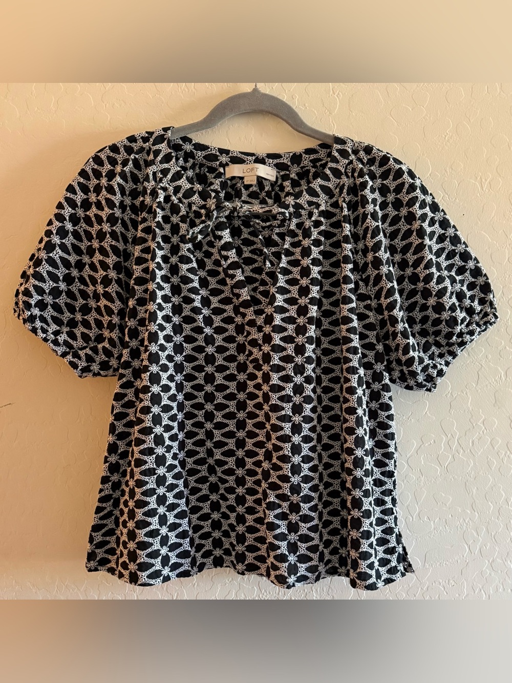 Loft, LP, black & white crochet, tie-neck top with a puff sleeve